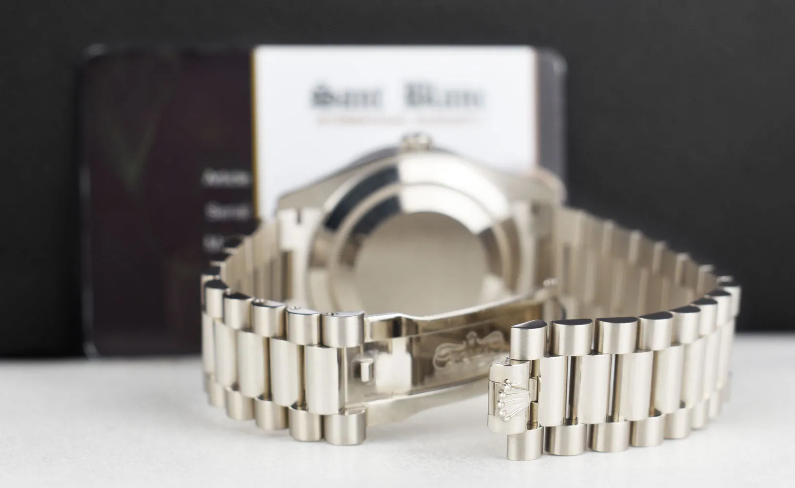 ROLEX 18kt White Gold Day Date 40 President Green Roman Dial Baguette Diamond Bezel Model 228239