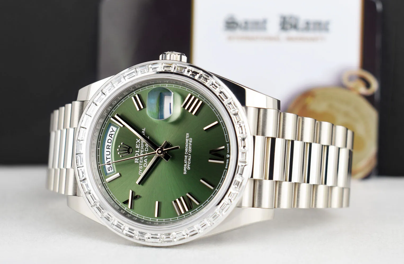 ROLEX 18kt White Gold Day Date 40 President Green Roman Dial Baguette Diamond Bezel Model 228239
